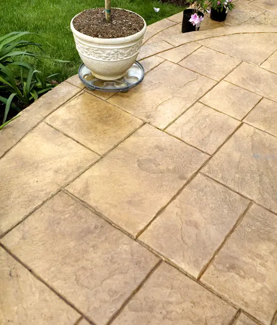 Parrots-Landing-Concrete-Co-decorative-concrete-patio-surrounded-by-grass